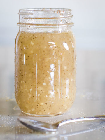 celery seed dressing pint sized jar with spoon beside it