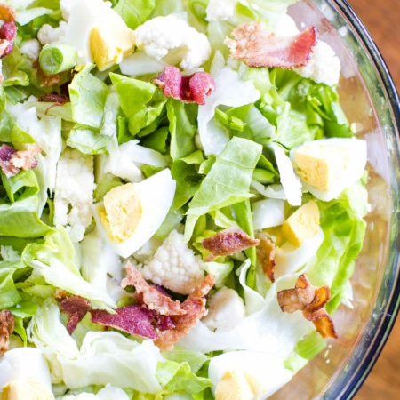 lettuce salad with homemade dressing on large bowl