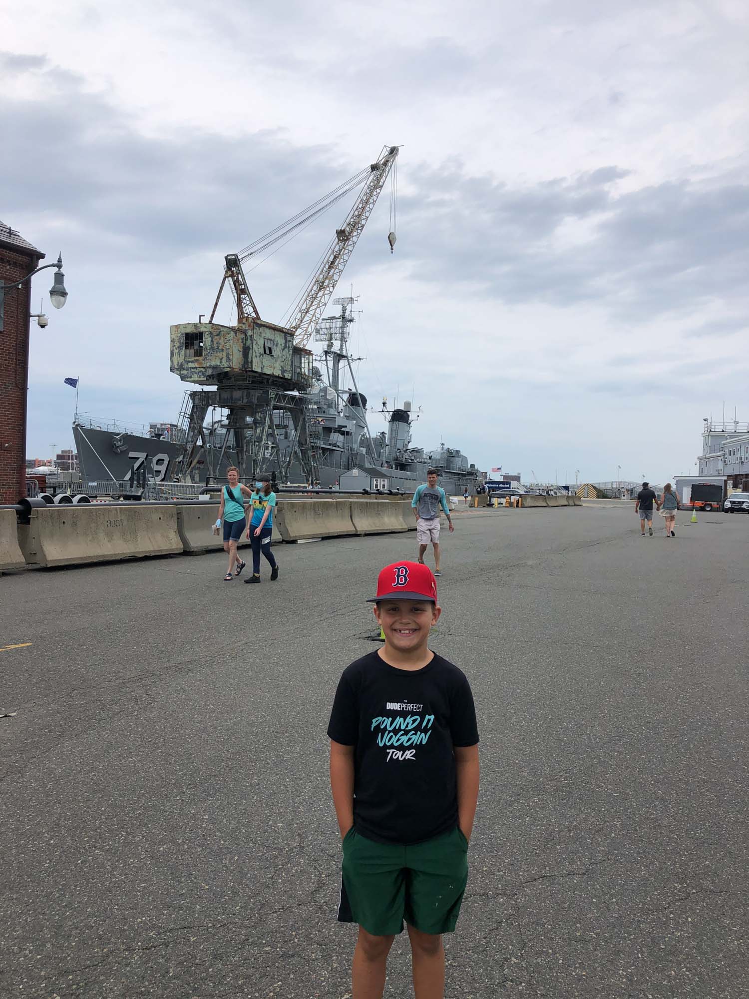 boy in front of uss constitution