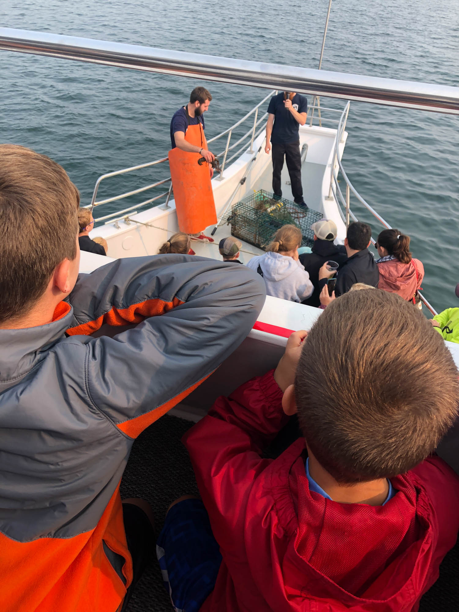 boys looking out at boat