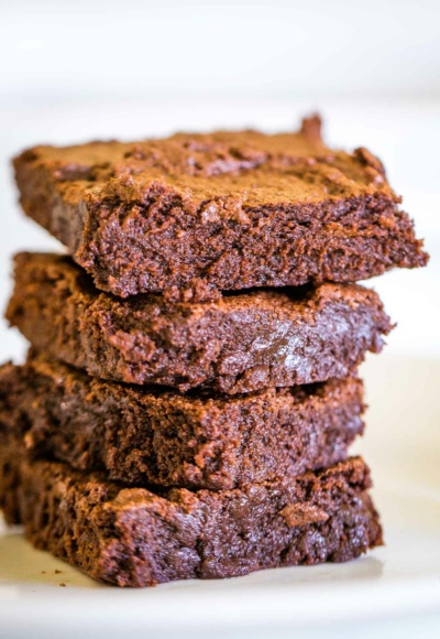 stack of four brownies on plate