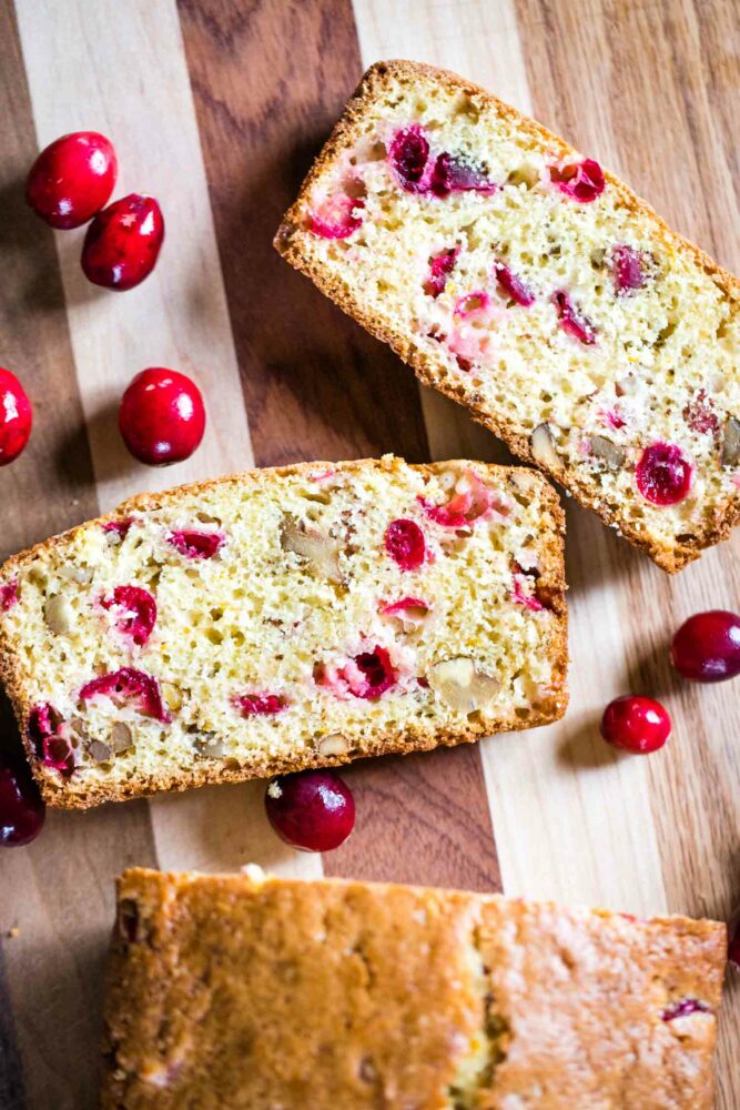 slices of cranberry nut bread on cutting board