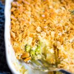 baking pan of broccoli cauliflower casserole with serving spoon