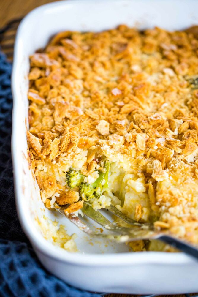 baking pan of broccoli cauliflower casserole with serving spoon