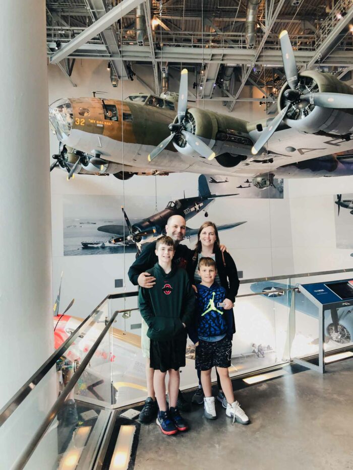 family in front of planes at WWII museum