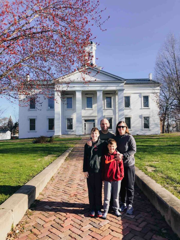 family in front of Lincoln's first place of work