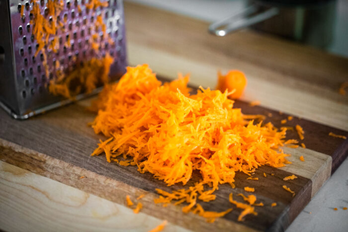 grated carrots on cutting board