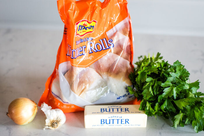 ingredients to make garlic bread on kitchen counter top