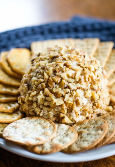 cream cheese ball on plate with crackers