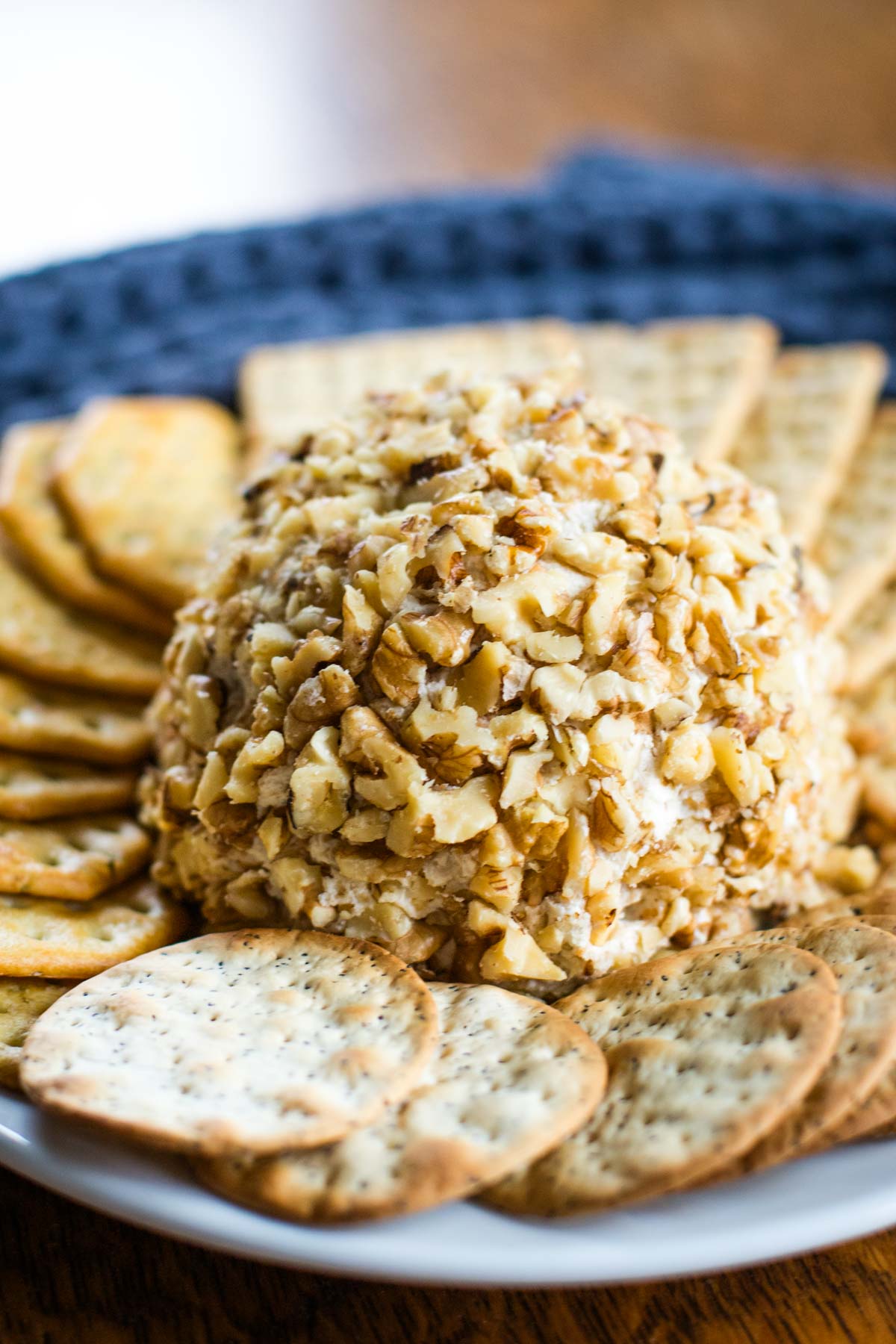 cream cheese ball on plate with crackers