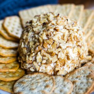 close up of cheese ball with crackers