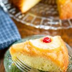 slice of pineapple upside down cake on plate with fork