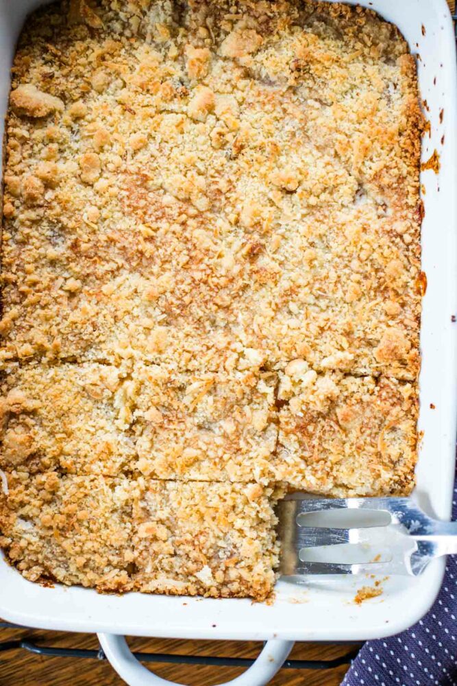 apricot bars in baking dish with serving spoon