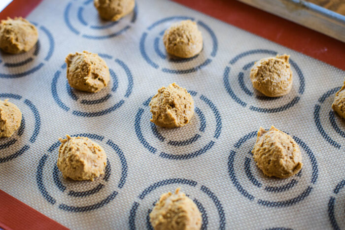 molasses cookie dough balls on baking sheet