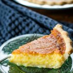 side view of buttermilk pie slice on plate
