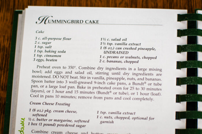 vintage recipe book with hummingbird cake recipe