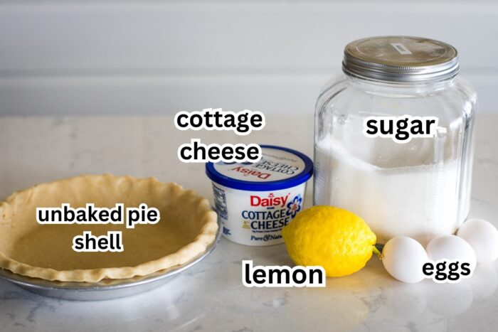 pie shell cottage cheese sugar lemon and eggs in picture