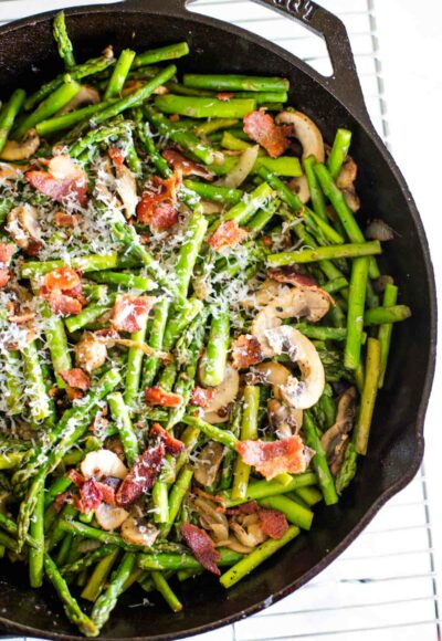 asparagus and mushrooms in cast iron skillet