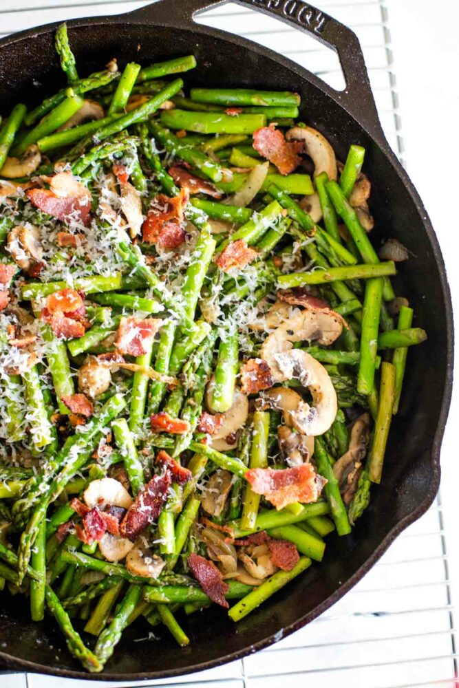 asparagus and mushrooms in cast iron skillet