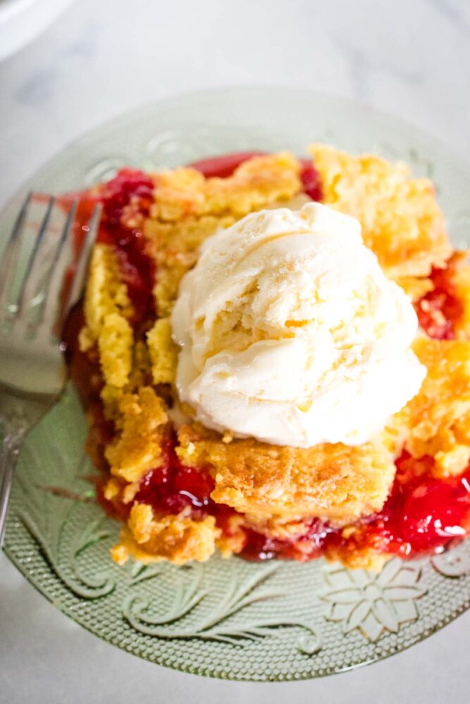 top view of cherry dump cake on plate