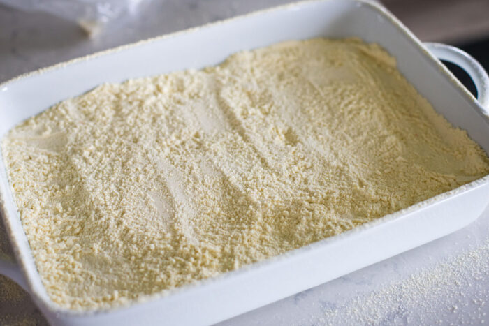 sifted yellow cake mix on top of cherry pie filling