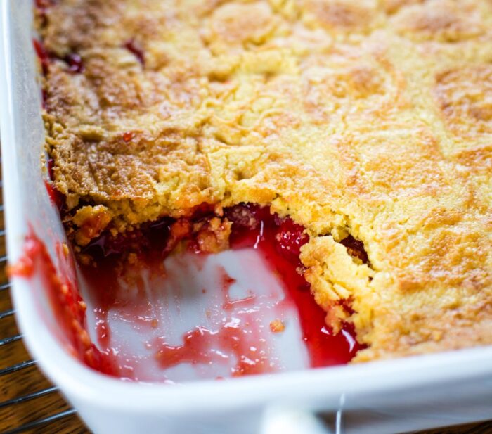 baked cherry dump cake in pan on cooling rack