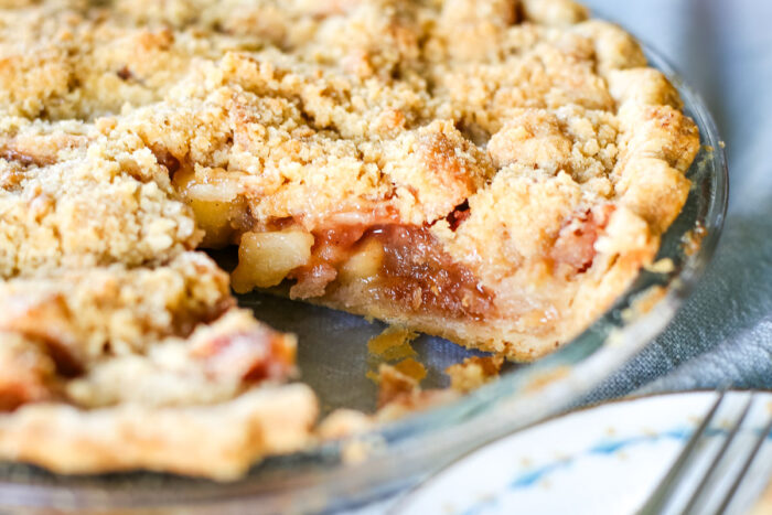 full dutch apple pie with slice taken out