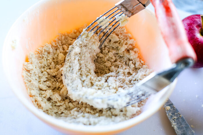 crumble topping in bowl with pastry blender