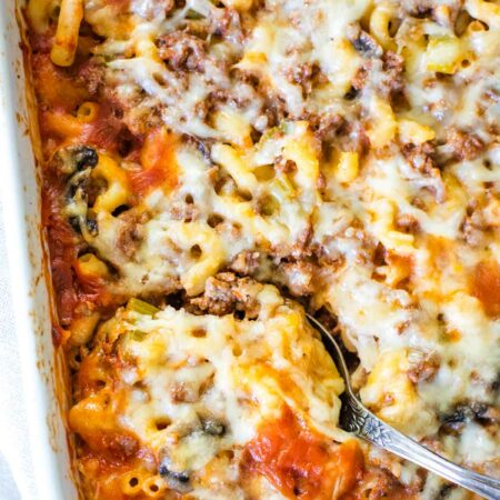 spoon scooping out marzetti from baking pan