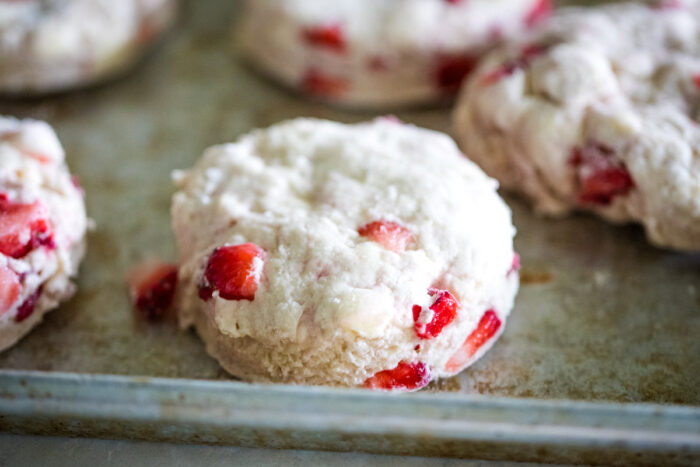 biscuit dough cut on baking pan before baking