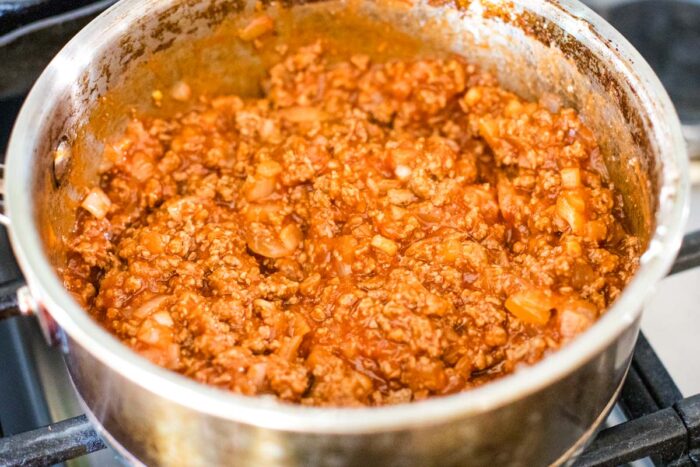 tomato sauce with hamburger on stove