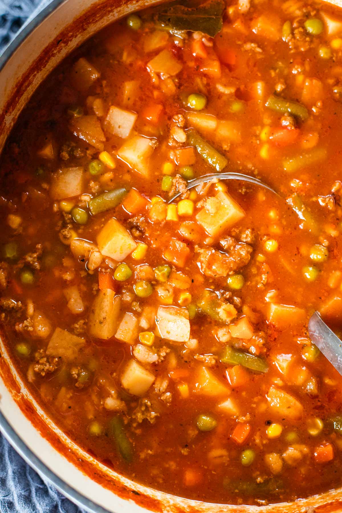 vegetable beef soup simmering on stove