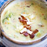 broccoli cheese soup in bowl topped with bacon