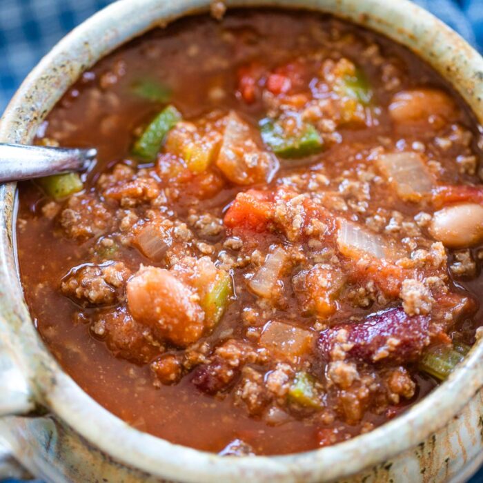 bowl of venison chili with spoon