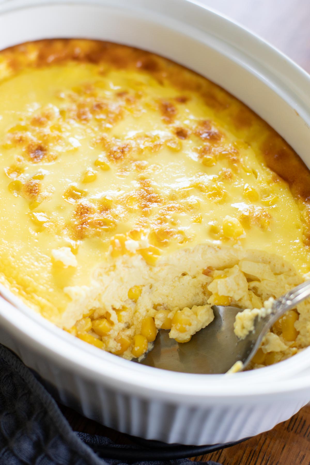 corn pudding scooped out of baking dish
