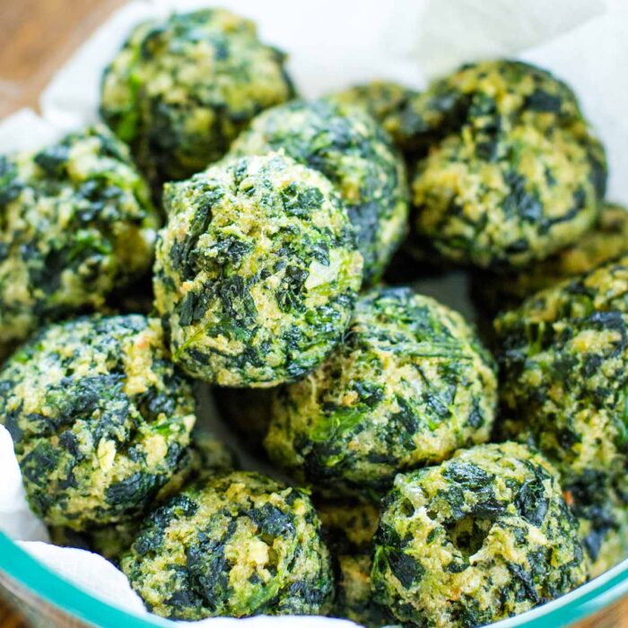 close up of spinach balls in serving dish