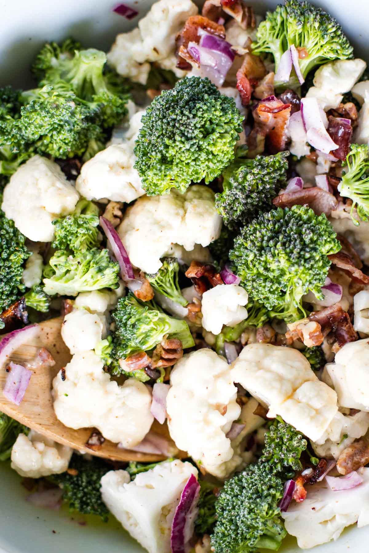tossed broccoli and cauliflower salad in large bowl