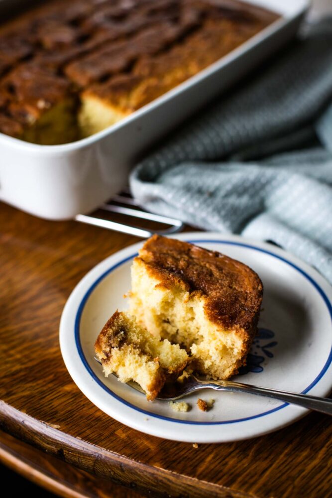 cinnamon coffee cake slice on plate with fork