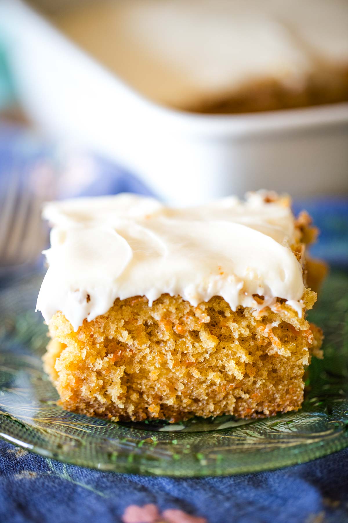 slice of carrot cake with pineapple on plate with fork