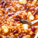 spoon scooping out 3 bean casserole serving