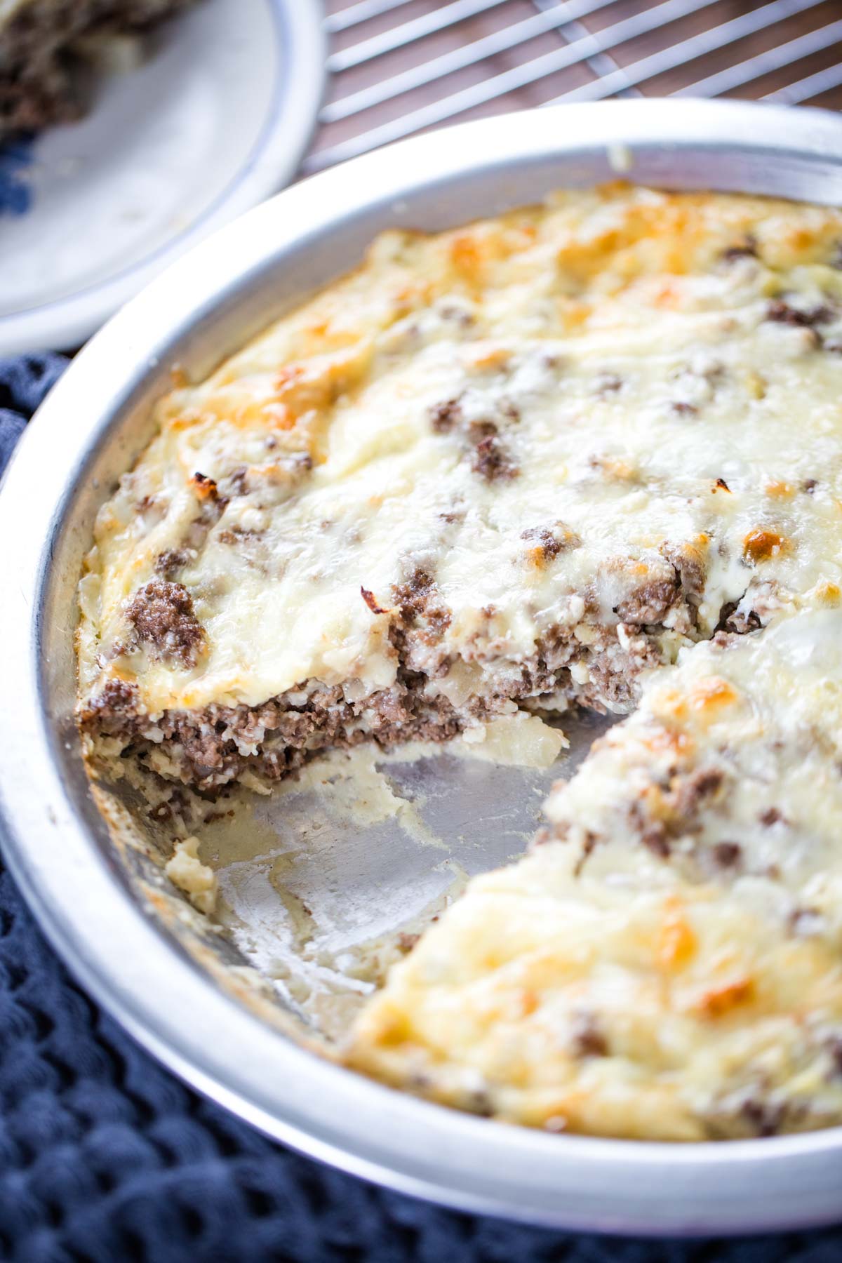 cheese burger pie with slice taken out