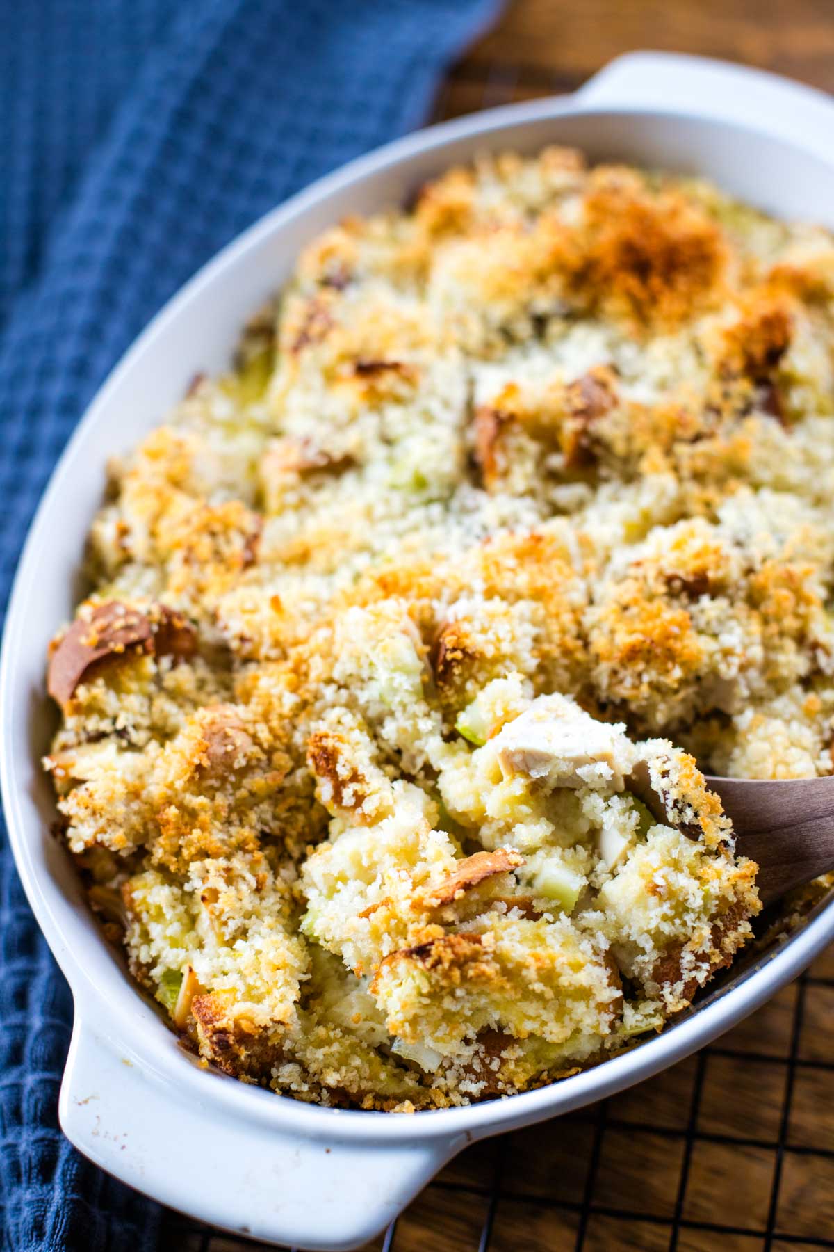 spoon scooping out serving of chicken bread casserole