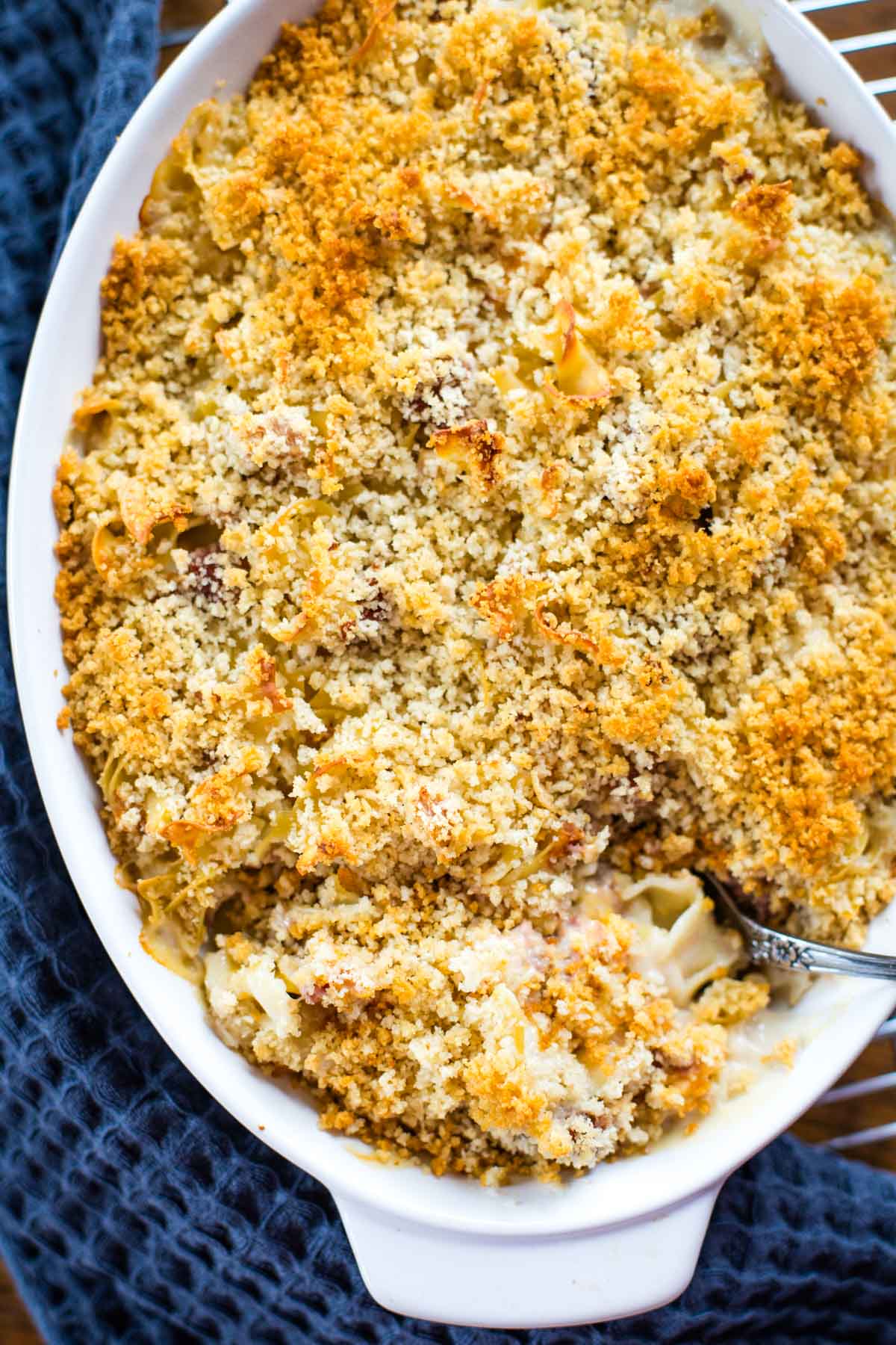 corned beef casserole in baking dish with spoon