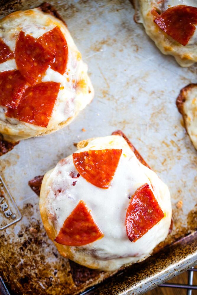 english muffin pizzas on baking pan