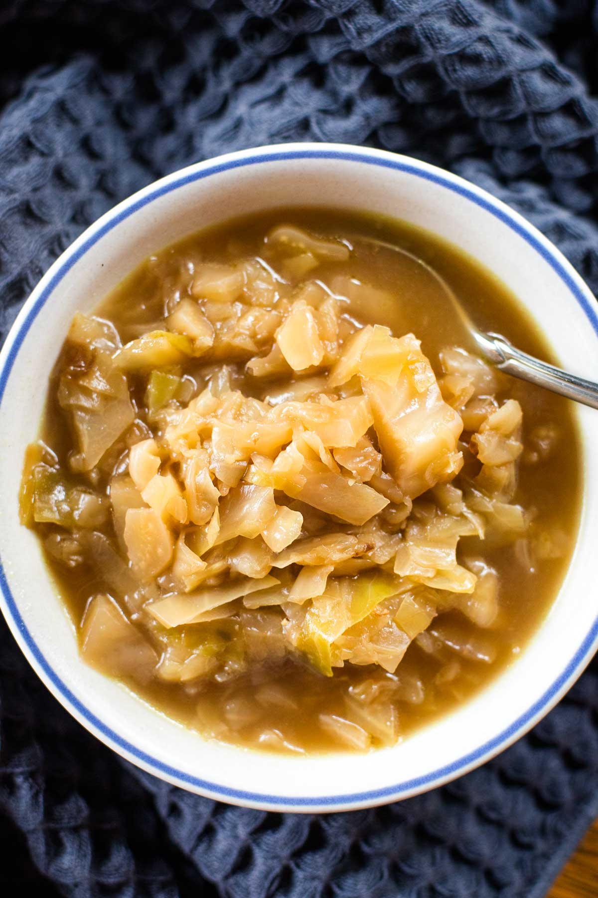 bowl of cabbage soup with spoon